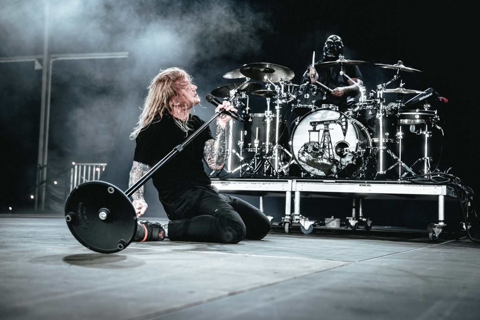 KING 810 / 2026 — Vocalist and drummer performing on stage