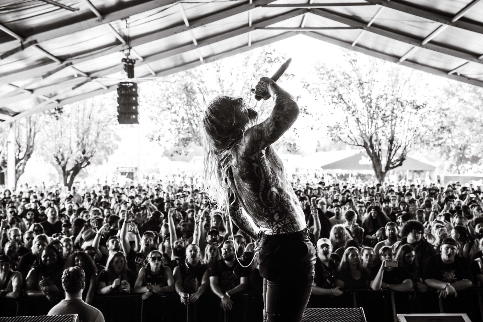 KING 810 / 2026 — Vocalist facing the festival crowd